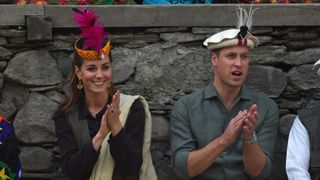 Prince William and Catherine, Duchess of Cambridge, watch a traditional Kalash dance