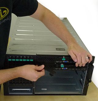 The Compute Modules in the MFSYS25 are securely fastened to the chassis by the two symmetrically placed release handles.