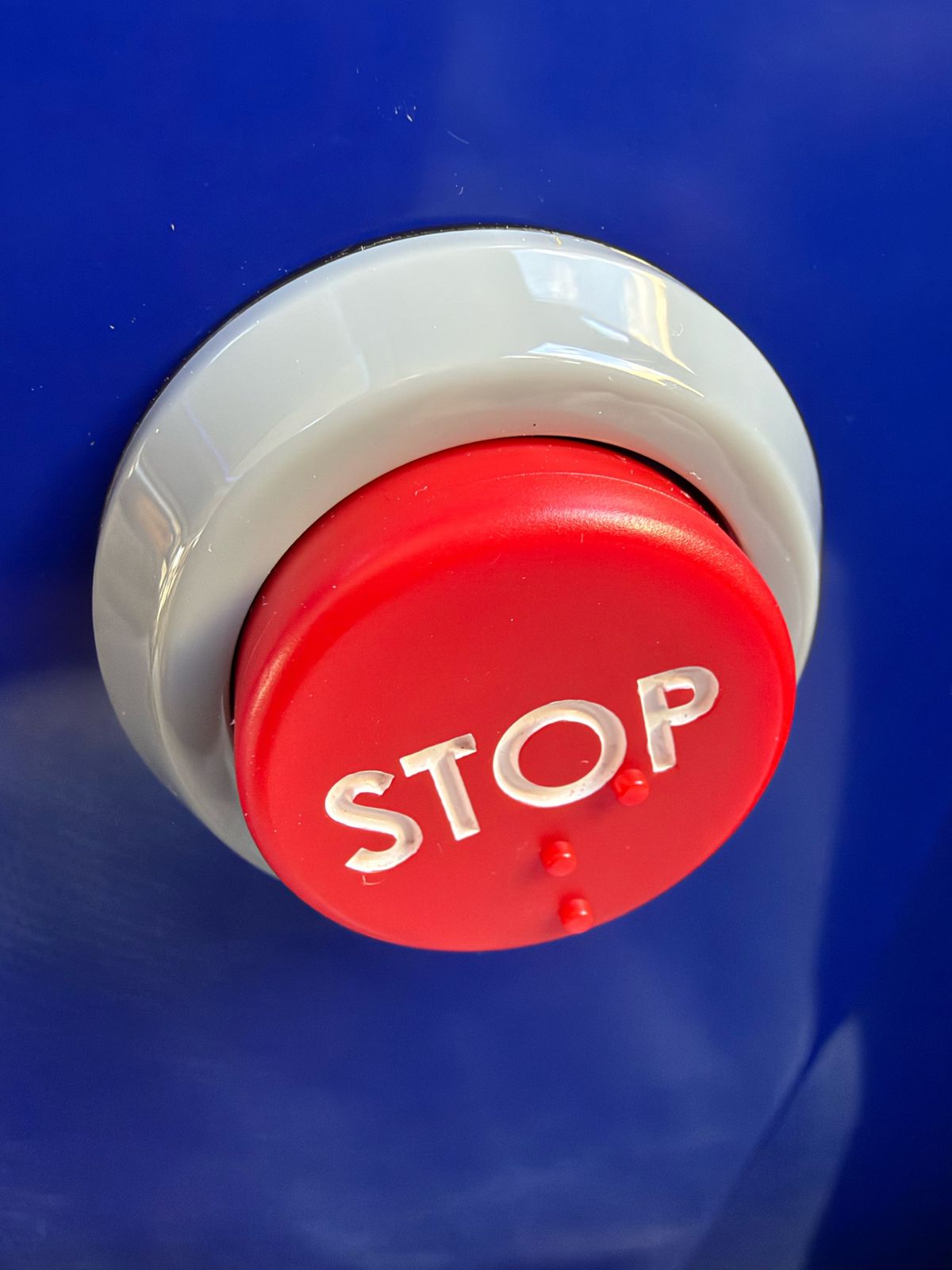 Stop button close up picture from a London bus