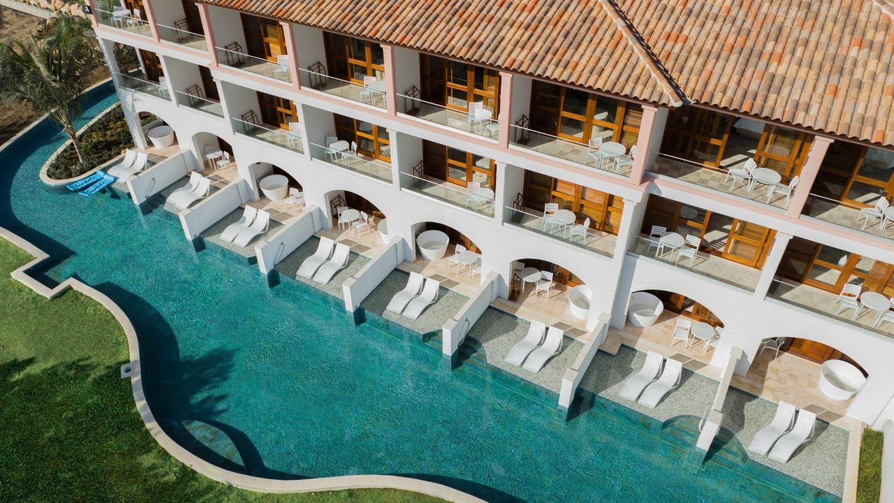 Arial view of the swim up pools at the sunchi rooms at Sandals Curacao