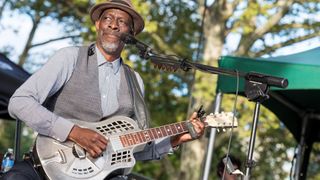 American Blues musician Keb' Mo' (born Kevin Moore) plays guitar with his band, TajMo (formed with fellow musician Taj Mahal), during a performance onstage at Central Park SummerStage, New York, New York, August 13, 2017