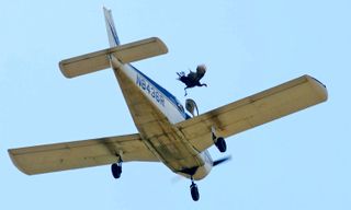 A wild turkey is released from a plane flying over Crooked Creek during the 72nd annual Turkey Trot in Yellville, Arkansas, Oct. 14, 2017. An investigation by the FAA into the event released their report in November 2017 saying they found no violations.