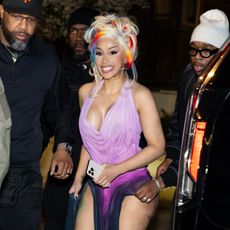 a paparazzi photo of cardi b wearing blonde hair with colorful streaks