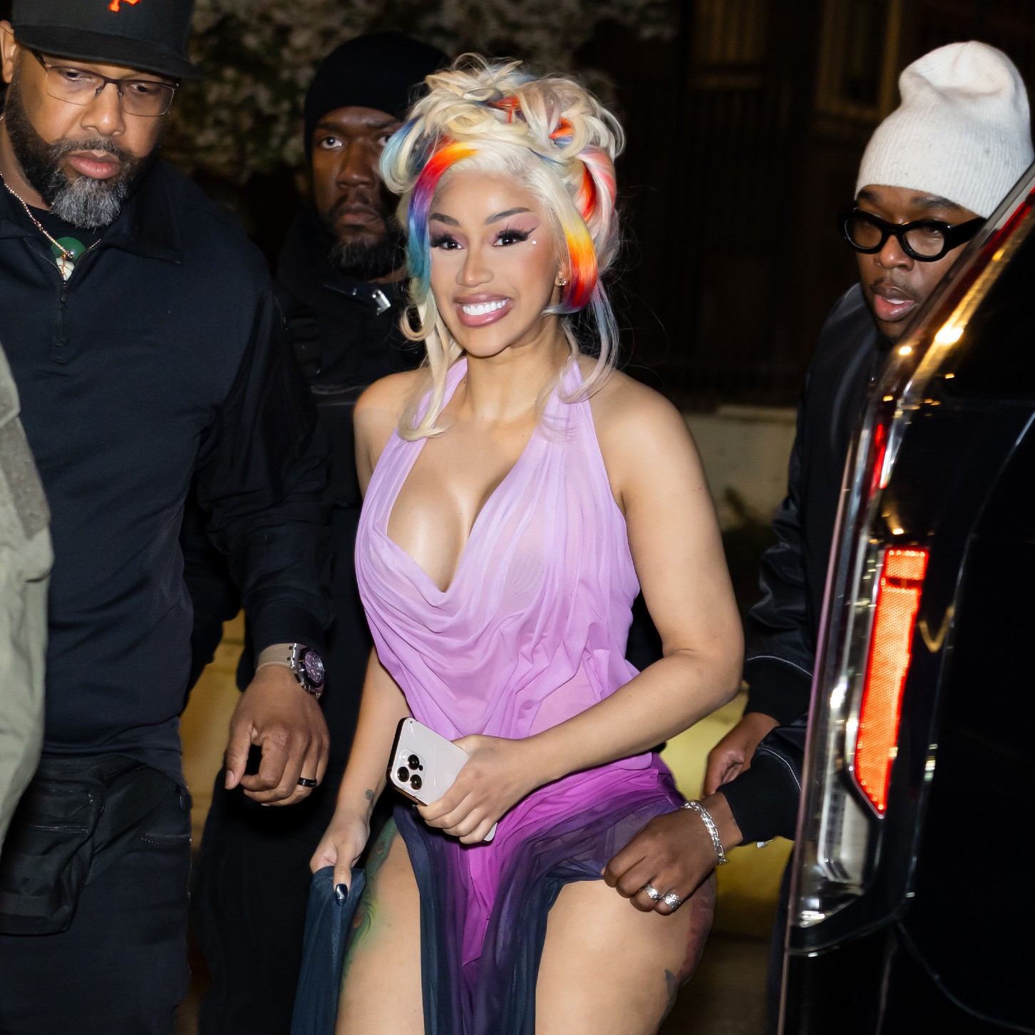 a paparazzi photo of cardi b wearing blonde hair with colorful streaks