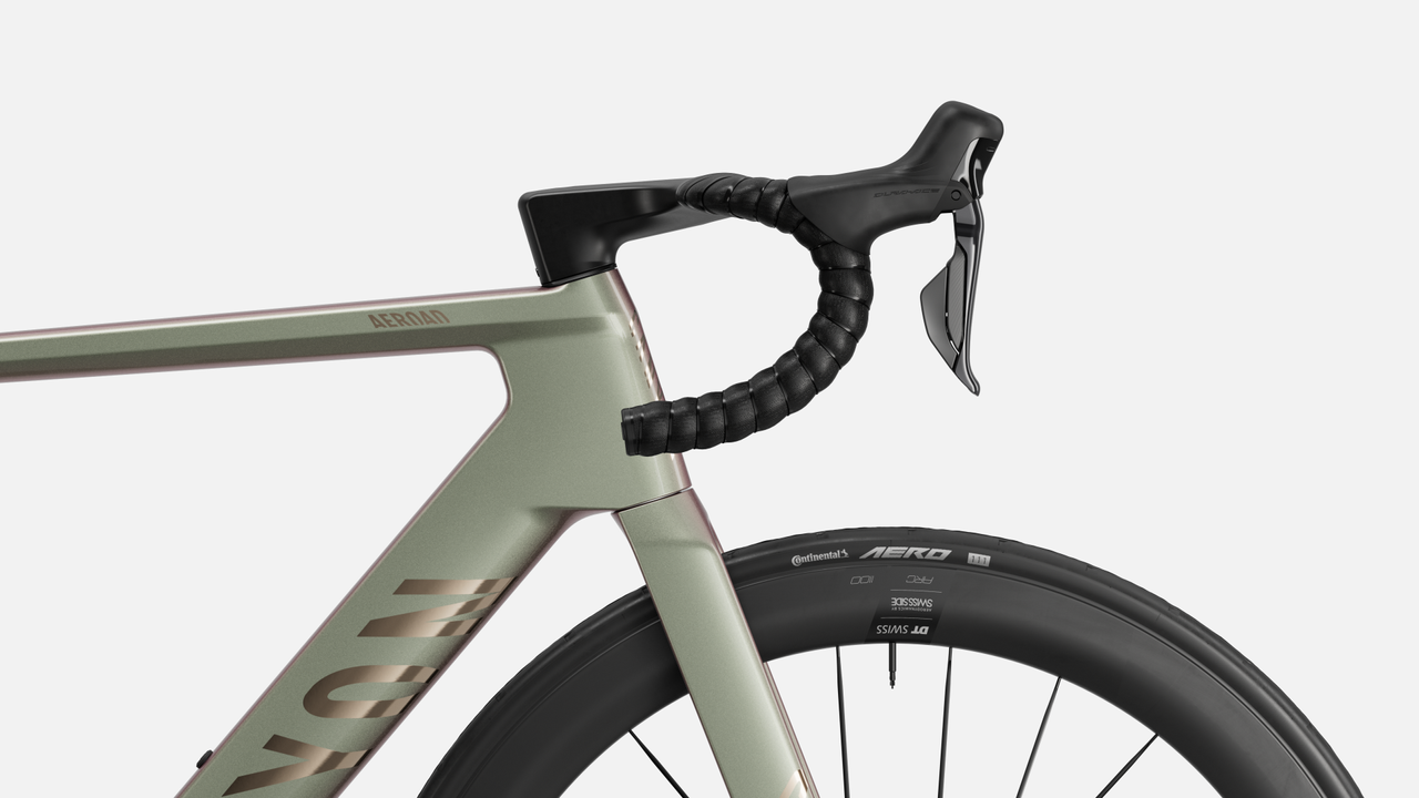 A canyon bike is shown side on cropped in on the handlebar