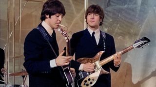 Musicians John Lennon (R) and Paul McCartney of English rock group The Beatles on the set of television special The Music of Lennon & McCartney at Granada Studios, Manchester, circa November 1965. 