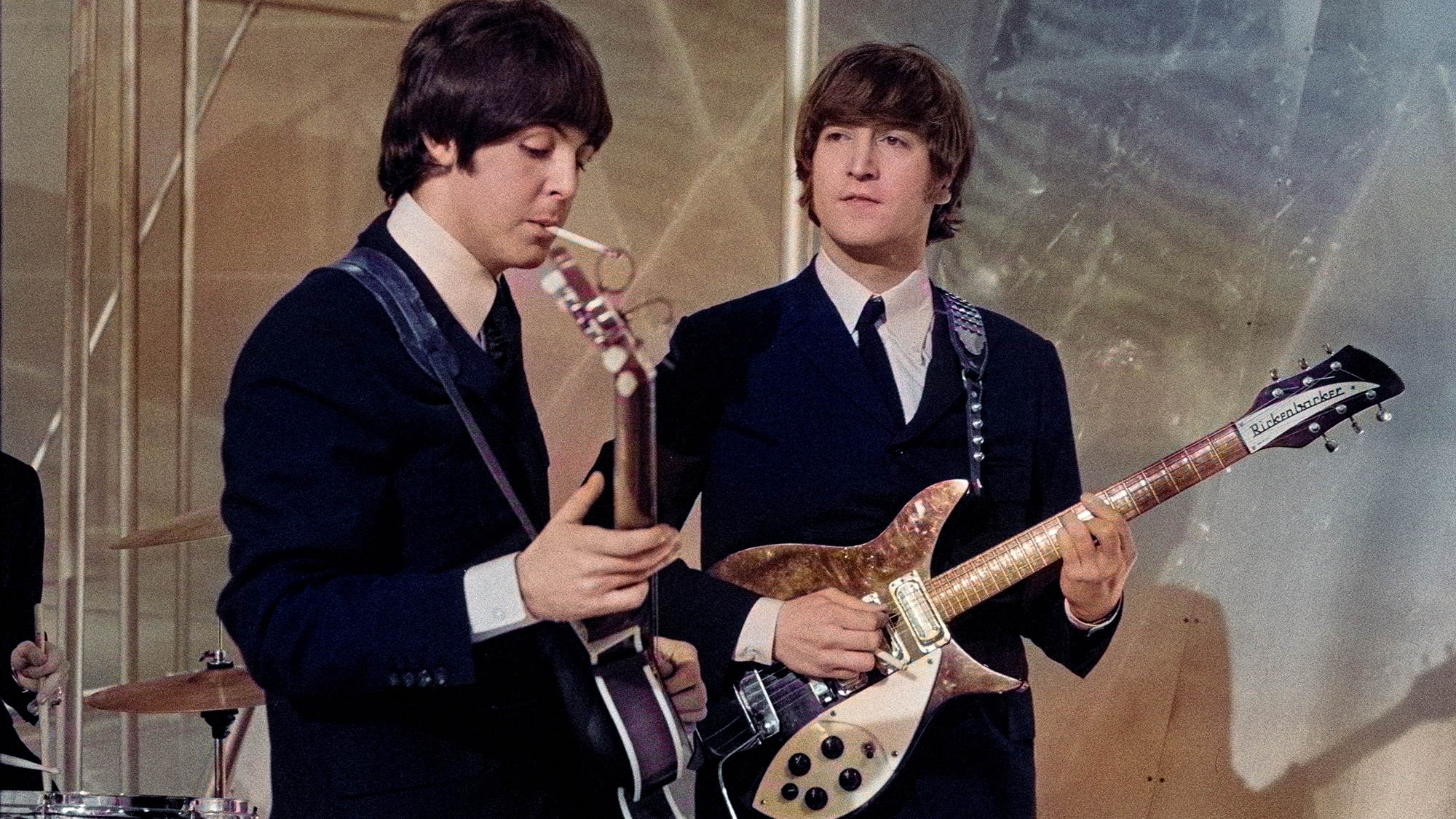 Musicians John Lennon (R) and Paul McCartney of English rock group The Beatles on the set of television special The Music of Lennon & McCartney at Granada Studios, Manchester, circa November 1965. 