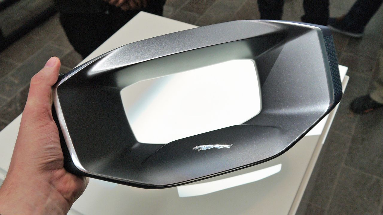 It has its own displays on the right and left of the hole, to show info such as time and weather