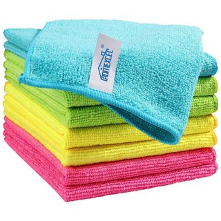 A neat stack of pink, yellow, green and blue microfiber cloths