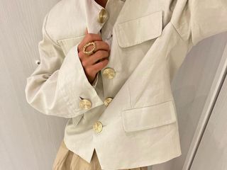 @annaaborisovna in an H&M Linen jacket with gold buttons