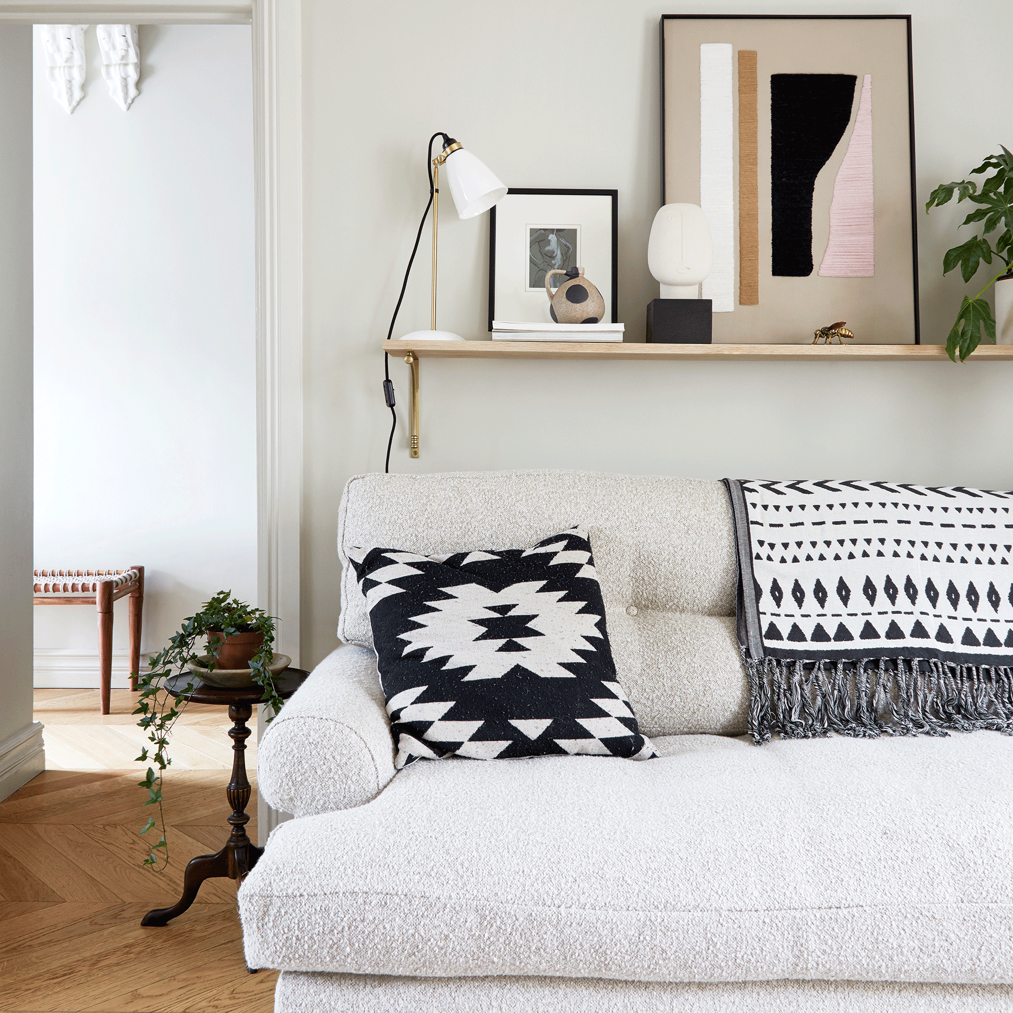 White living room with picture rail and boucle sofa