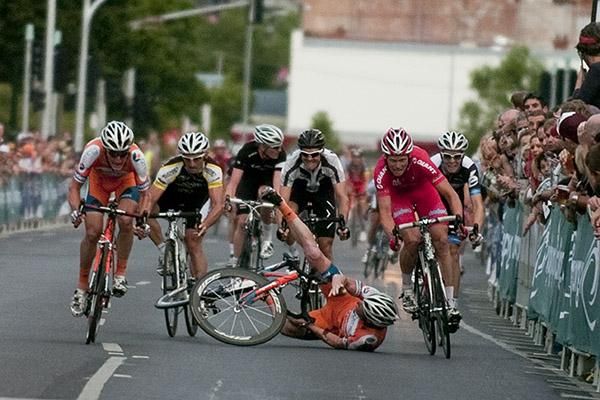 Joel Pearson (Genesys Wealth Advisers) hits the road while Stuart Shaw (right) of Drapac Porsche did well to avoid him and make it onto the podium.