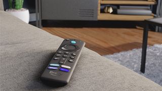 Amazon Fire TV Stick 4K Max remote resting on sofa