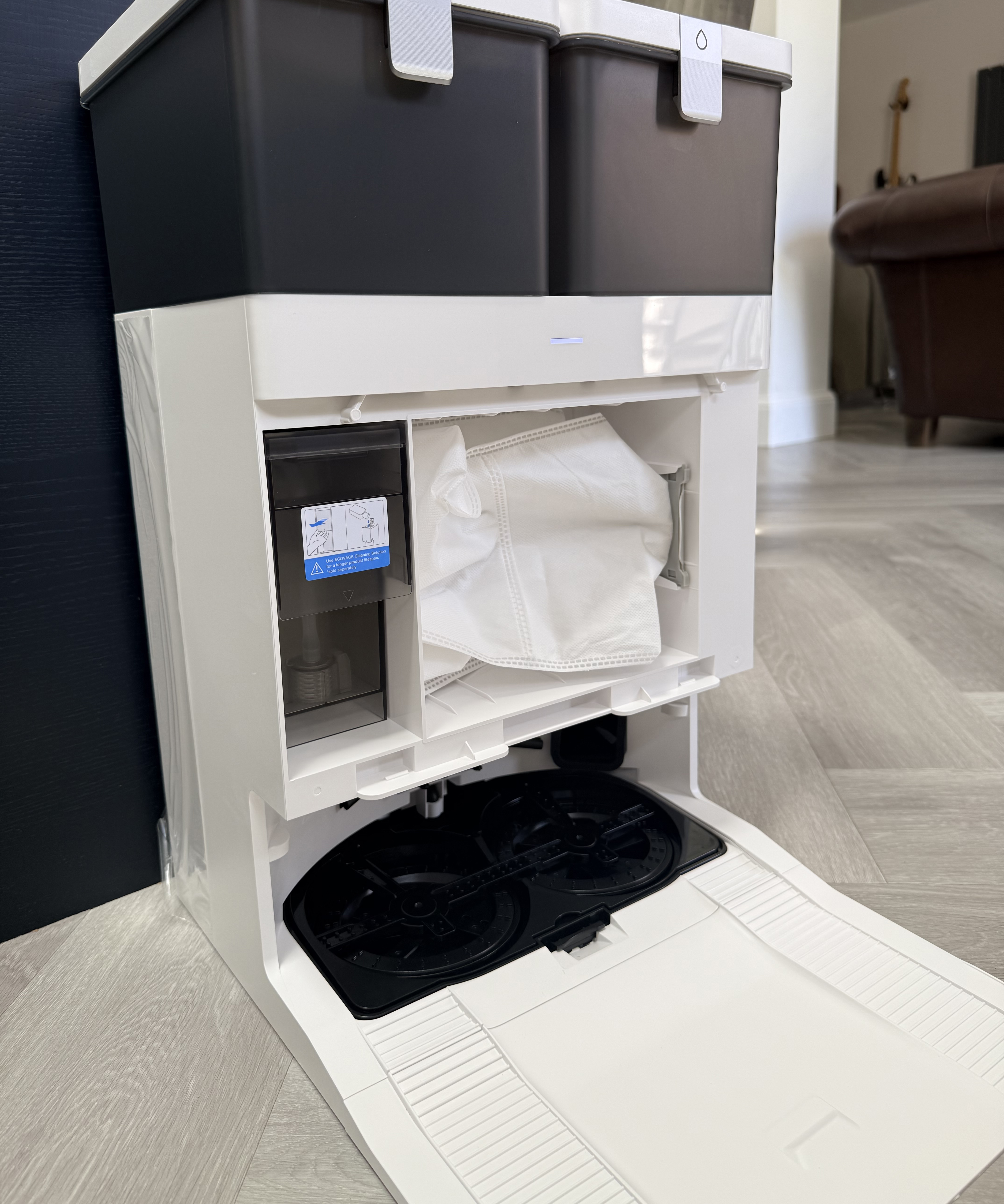 Open Ecovacs Deebot T50 Pro Omni OMNI Station showing the dust bag compartment and mop washing area