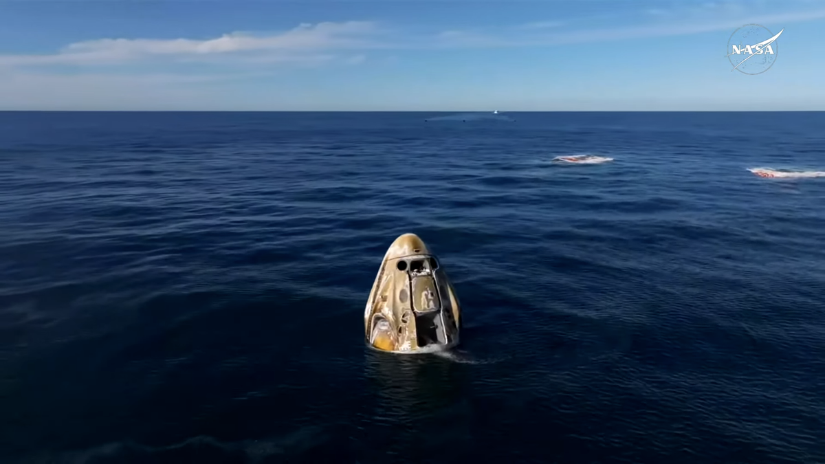 A white SpaceX Dragon capsule bobs in the Gulf of Mexico after splashing down with four Crew-9 astronauts off the coast of Tallahassee, Florida on March 18, 2025.