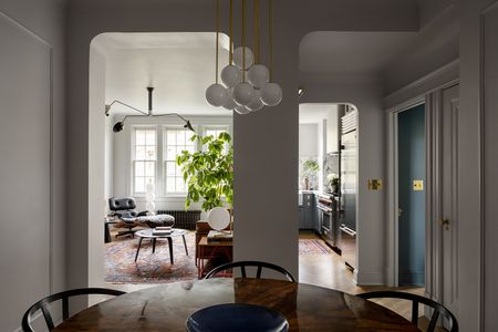 apartment living room and kitchen with mid century furniture