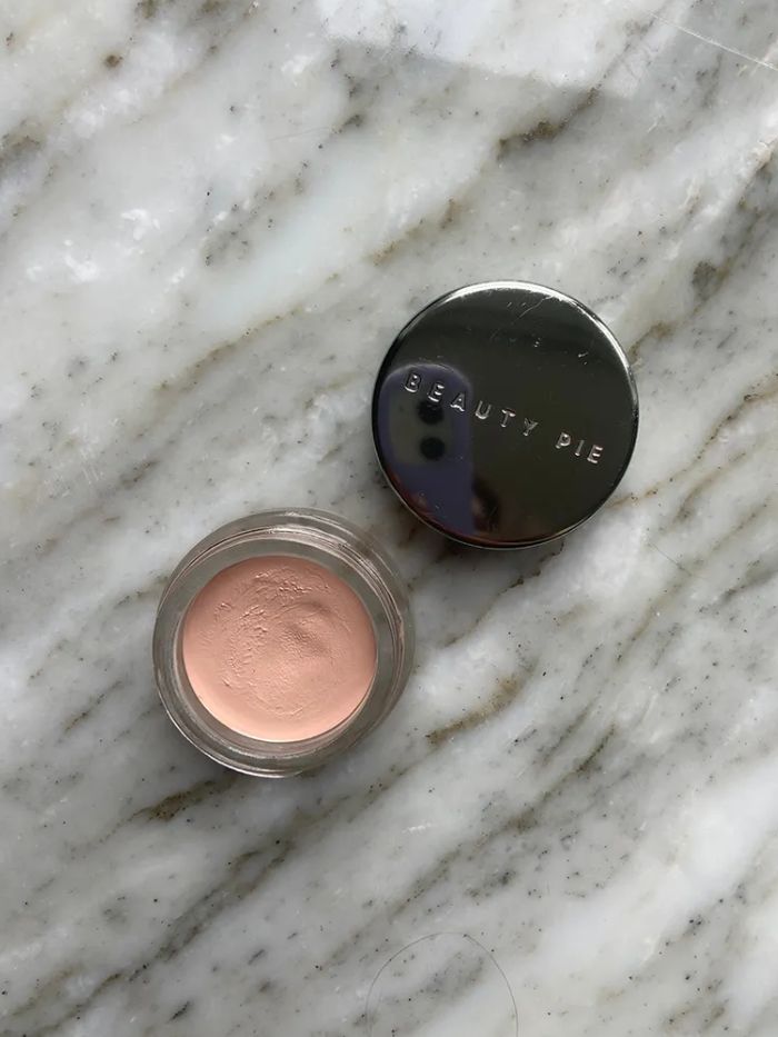 Beauty Pie Superluminous Under-Eye Genius on a marble background