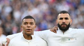 France team-mates Kylian Mbappe and Karim Benzema ahead of a UEFA Nations League game against Croatia in June 2022.