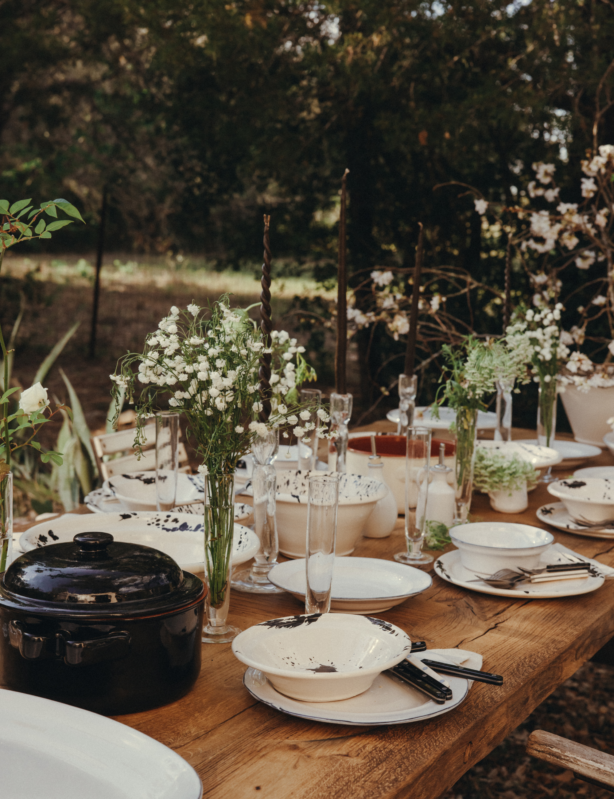 Rustic outdoor tablescape styled with splatterpaint ceramics by Leanne Ford x il Buco Vita