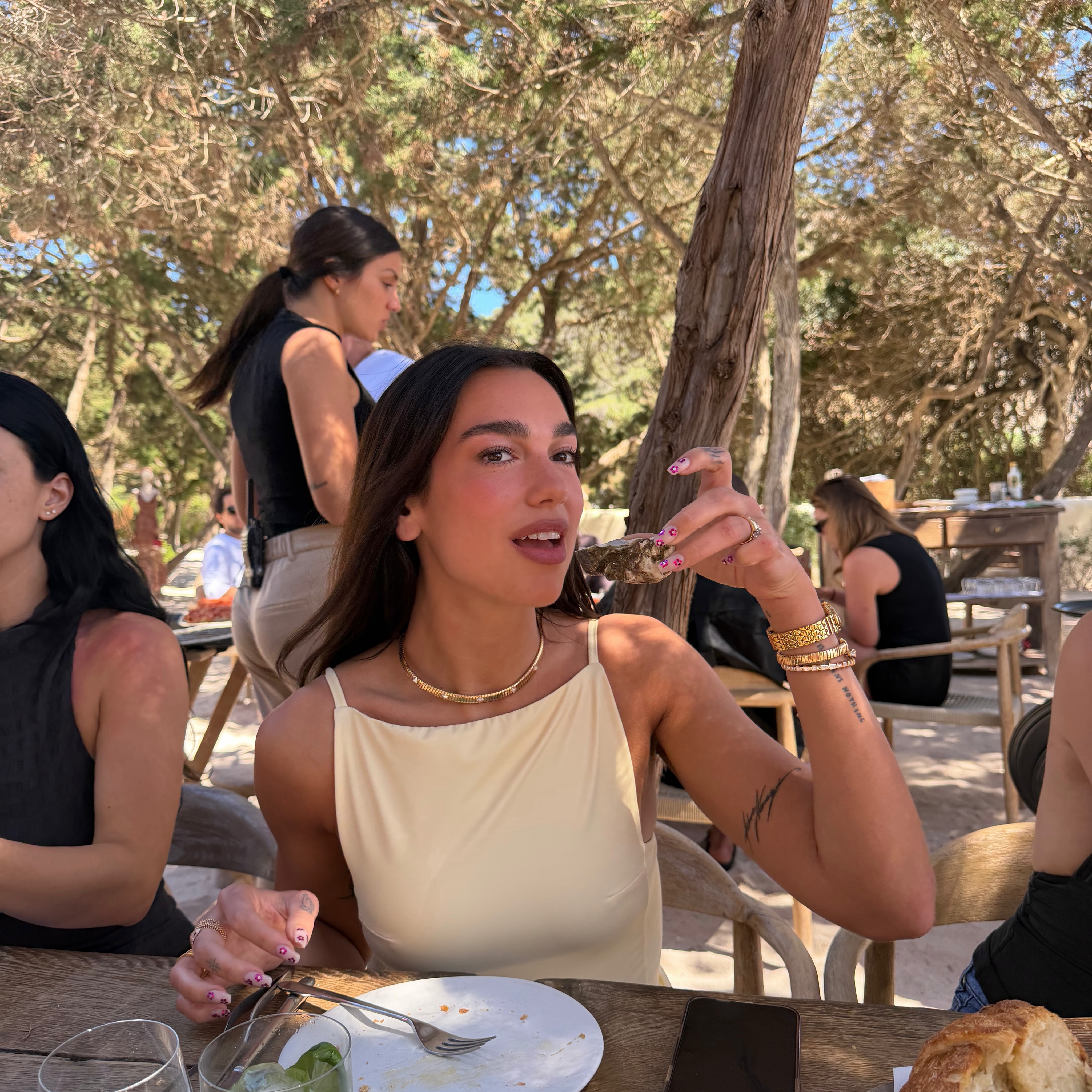 Dua Lipa with bedazzled nails
