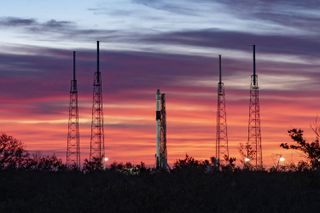 A SpaceX Falcon 9 rocket carrying the Dragon CRS-19 cargo ship stands poised for launch at the Cape Canaveral Air Force Station in Florida on Dec. 5. 2019.