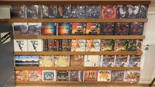 A shelving unit in a record shop with various movie and TV soundtracks