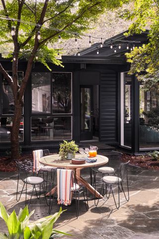 Patio with bistro set and string lighting