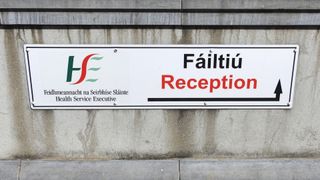 HSE Reception entrance wall sign in English and Irish language