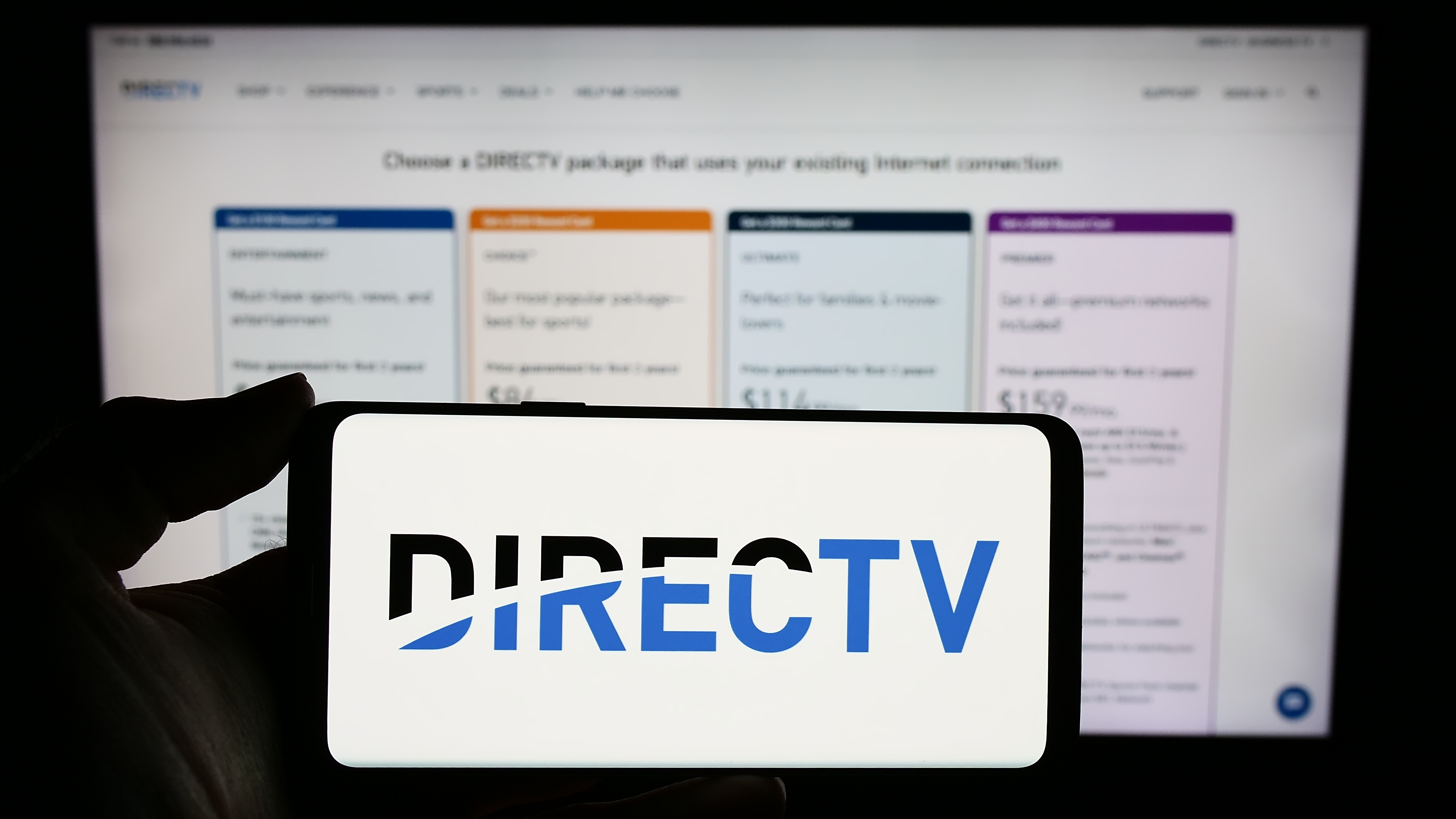 DirecTV logo on a smartphone.