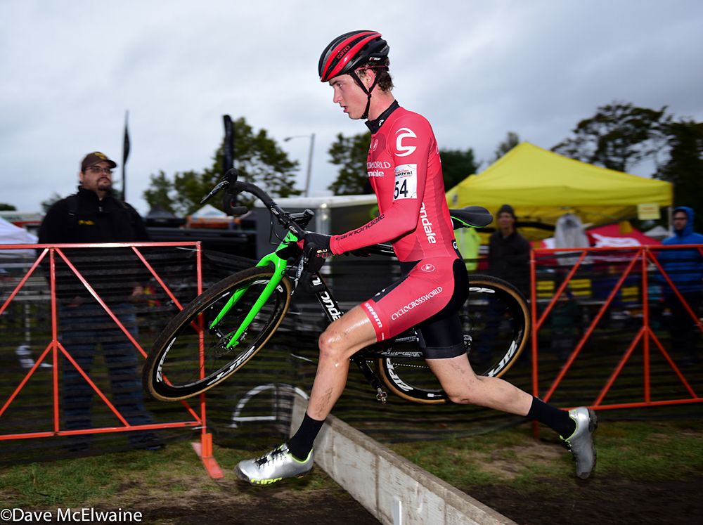 Cooper Willsey (Cyclocrossworld.com) running the barriers on lap four