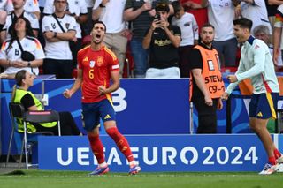 Mikel Merino celebrates after scoring Spain's winning goal against Germany in the quarter-final of Euro 2024