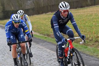 NOKERE BELGIUM MARCH 17 Jannik Steimle of Germany and Team Deceuninck QuickStep Jacob Egholm of Denmark and Team Trek Segafredo during the 75th Nokere Koerse Danilith Classic 2021 Mens Elite a 1955km race from Deinze to Nokere NokereKoerse on March 17 2021 in Nokere Belgium Photo by Luc ClaessenGetty Images