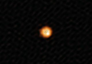 This is the sharpest image ever taken of the star W Hydrae, which has the same mass as Earth's sun but has swollen to an enormous size. The dotted line shows the diameter of Earth's orbit around the sun, for comparison.