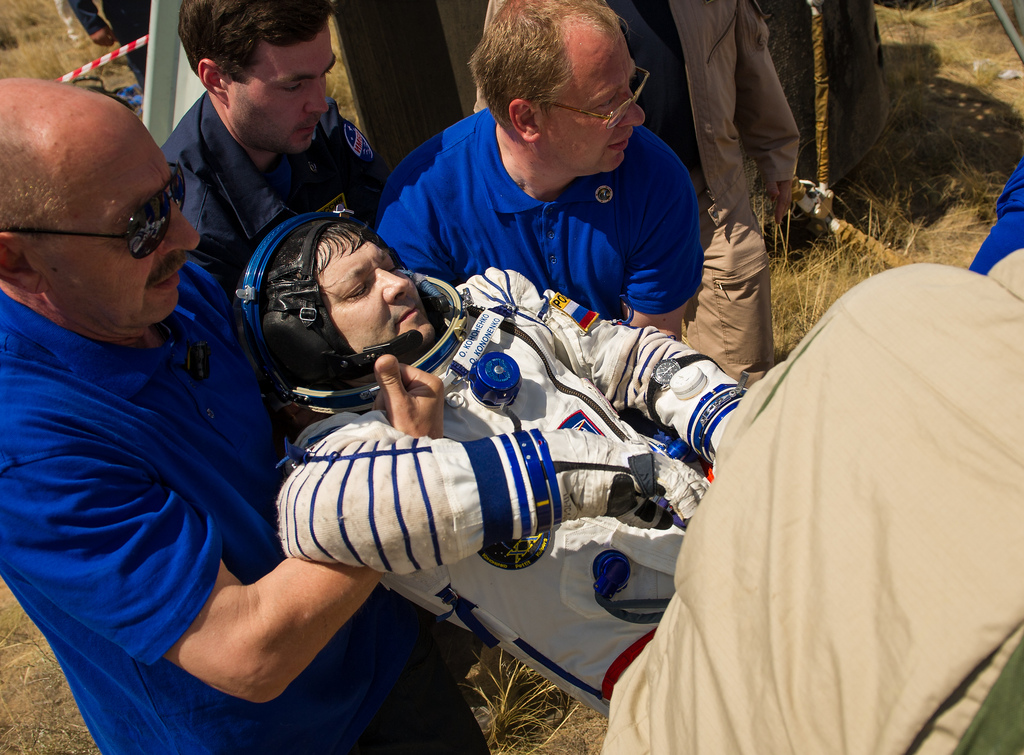 Commander Oleg Kononenko Carried by Support Team