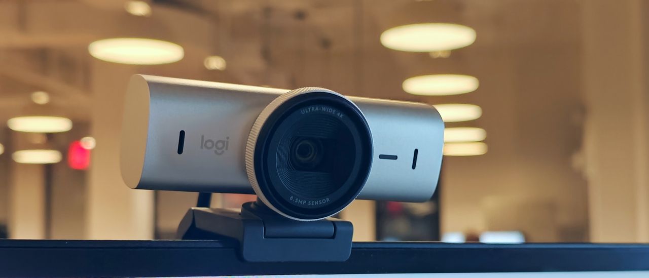 Logitech MX Brio 4K webcam mounted on a monitor angled downward