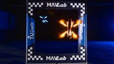 A box showing a small glowing drone inside it