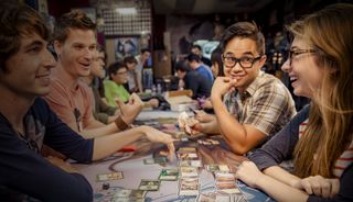 people playing a game of Magic The Gathering