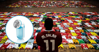  fan of the Liverpool football team stands in-front of the 1278 jerseys displayed side by side on the floor during the Malaysia Book of Records event for the most number jerseys on display of a single team in Kuala Lumpur on April 11, 2018. Malaysia Book of Records announced 1,278 Liverpool jersey from collectors around Malaysia