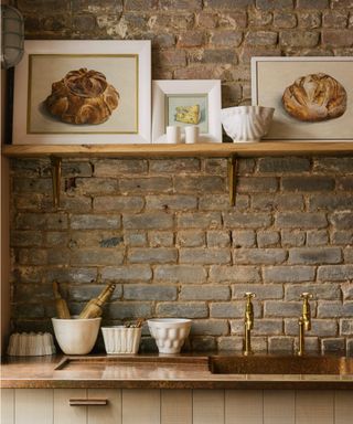 deVOL kitchens exposed brick opening shelving gallery wall