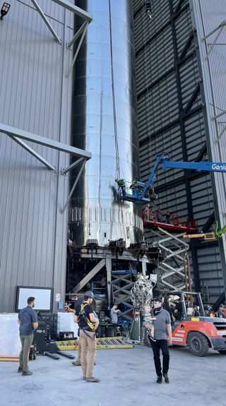 "Installing Starship booster engines for first orbital flight," SpaceX founder and CEO Elon Musk wrote about this photo, which he posted on Twitter on Aug. 1, 2021.