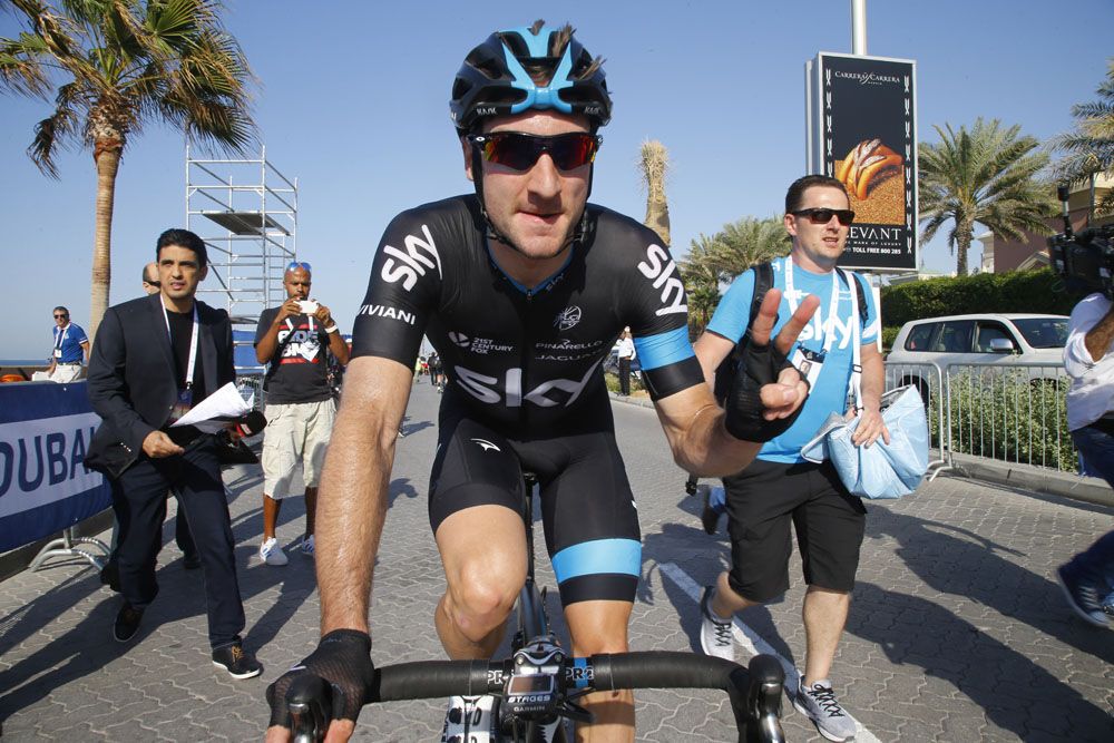 Elivi Viviani makes his way to the podium after winning