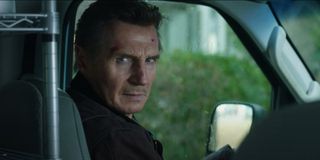 Honest Thief Liam Neeson looking at the camera with a chilling stare