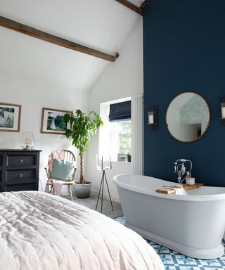 Emma and Martin Coulthurst transformed a bedroom and bathroom into a master suite with statement bath