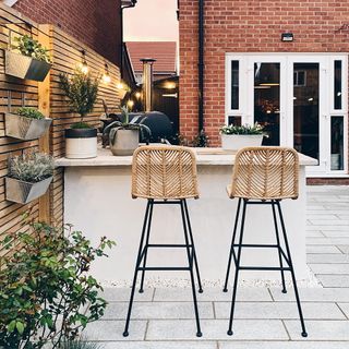 garden kitchen with chair brick wall and wooden fencing