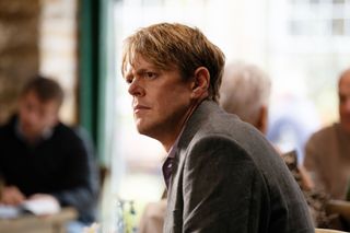 A close up shot of Humphrey (Kris Marshall) in semi-profile, sitting down with a look of mild concern on his face