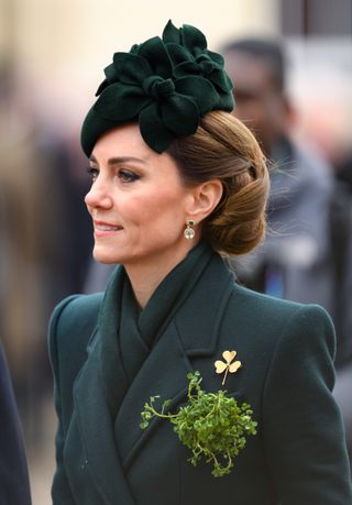 Kate Middleton wearing a green coat with shamrocks pinned on it on St Patrick's Day 2025