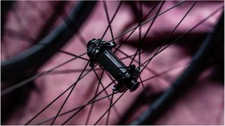 A black front wheel built around the Deda RS front hub
