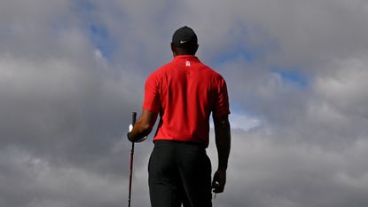 A shot of the back of Tiger Woods wearing his Sunday Red Nike polo shirt and TW-branded cap