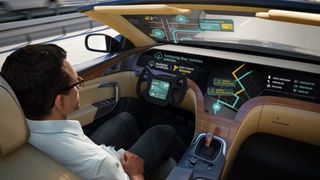 Man sitting in driver position in a driverless car