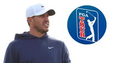 Brooks Koepka from the chest up wearing a navy Nike hoodie and white cap, with a PGA Tour logo in the top-right